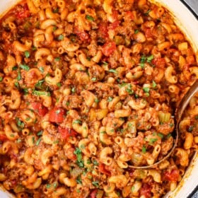 top view of chop suey recipe in a Dutch oven garnished with parsley