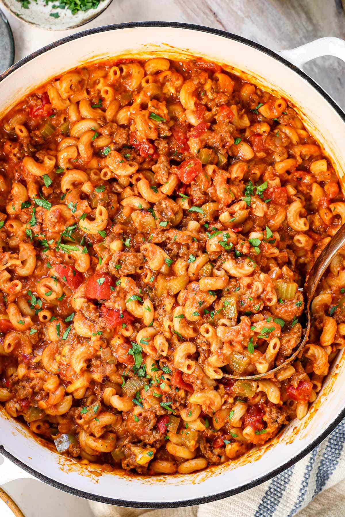 top view of chop suey recipe in a Dutch oven garnished with parsley