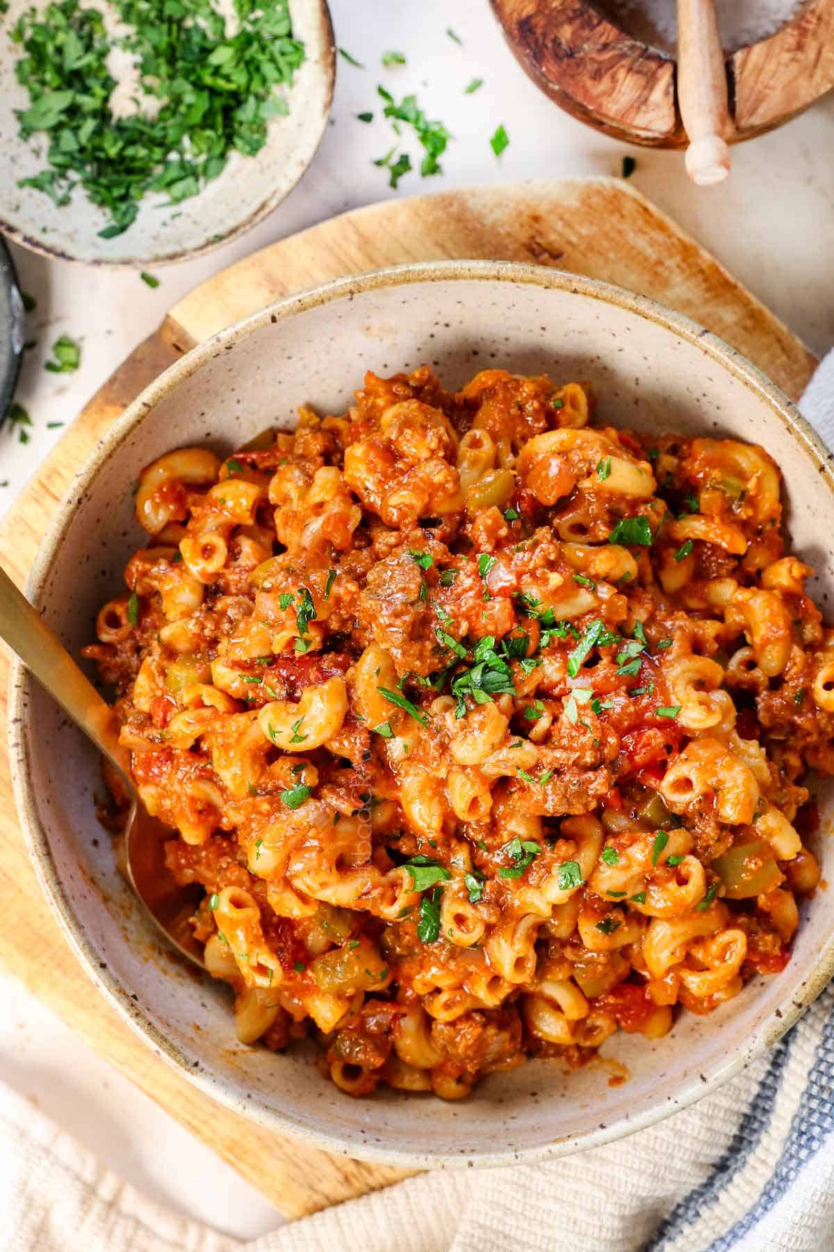 top view showing how to serve chop suey in a bowl garnished with cheese and parsley