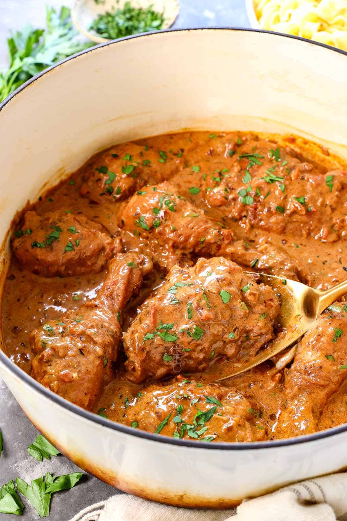 showing how to make chicken paprikash by simmering until thickened