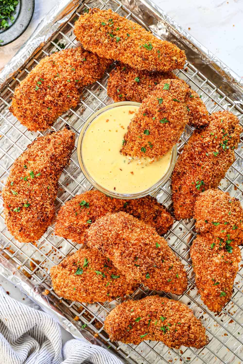 showing how to make chicken strips by baking on a baking rack