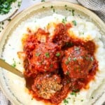 showing how to serve porcupine meatballs on a plate with mashed potatoes