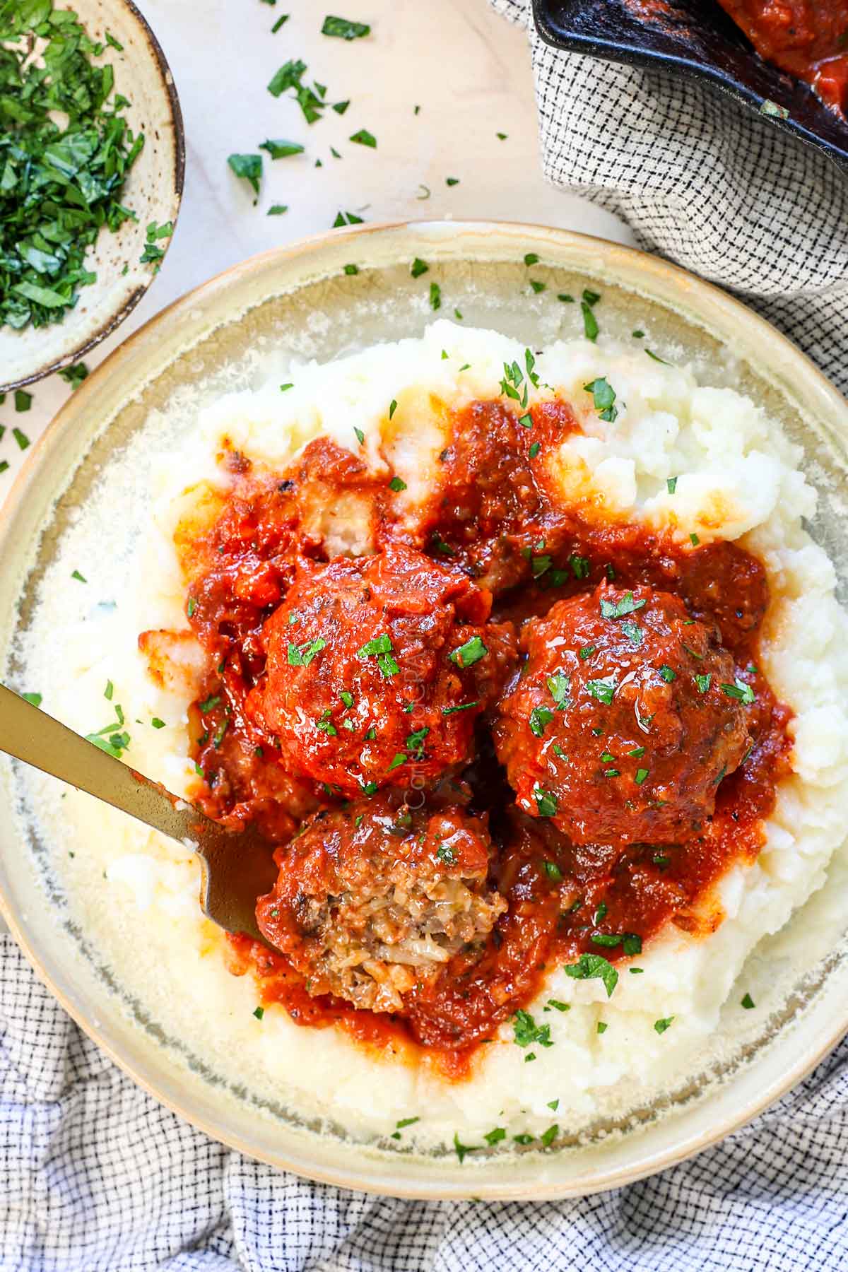 showing how to serve porcupine meatballs on a plate with mashed potatoes