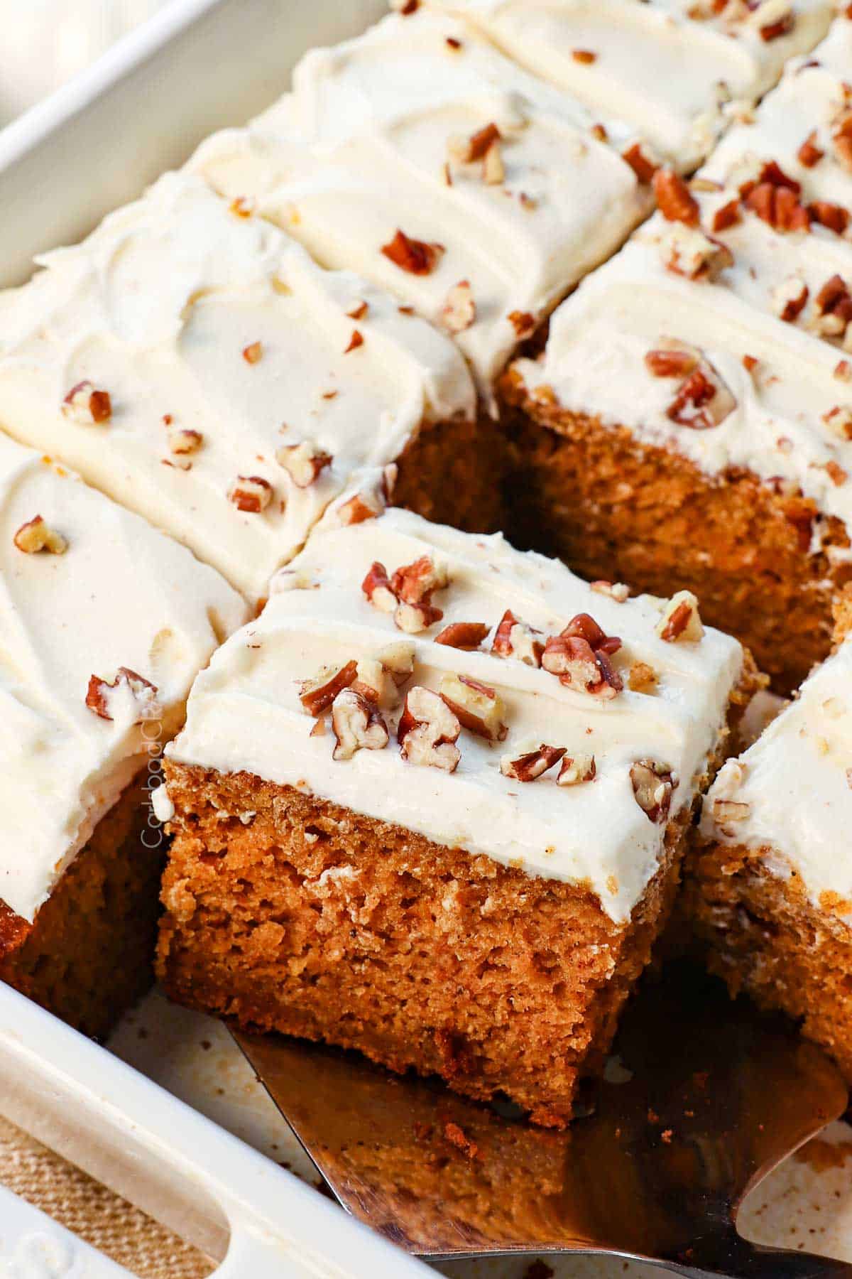 up close of a spatula serving a slice of pumpkin cake