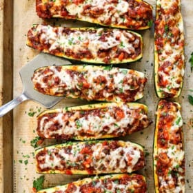 showing how to make zucchini boats by baking until the cheese is melted