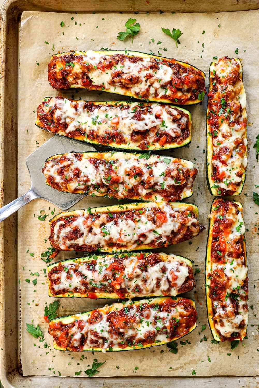 showing how to make zucchini boats by baking until the cheese is melted
