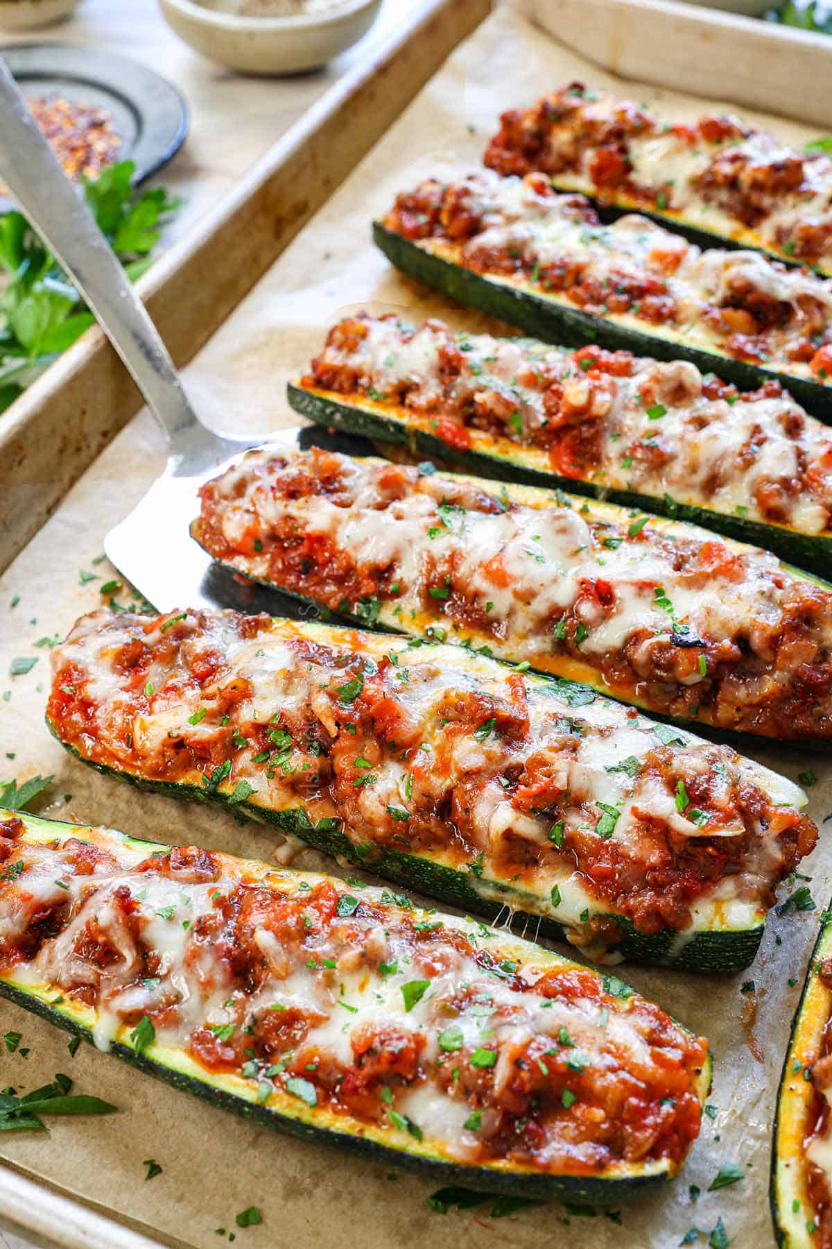stuffed zucchini boats filled with Italian sausage, marinara, and zucchini