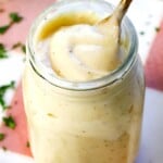 cream of chicken soup in a jar with a spoon showing how thick and creamy it is