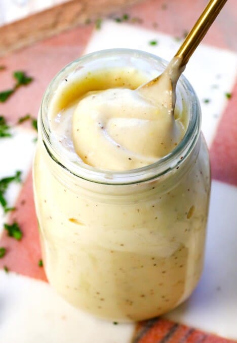 cream of chicken soup in a jar with a spoon showing how thick and creamy it is